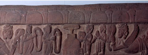 Worshippers bearing garlands at a stupa